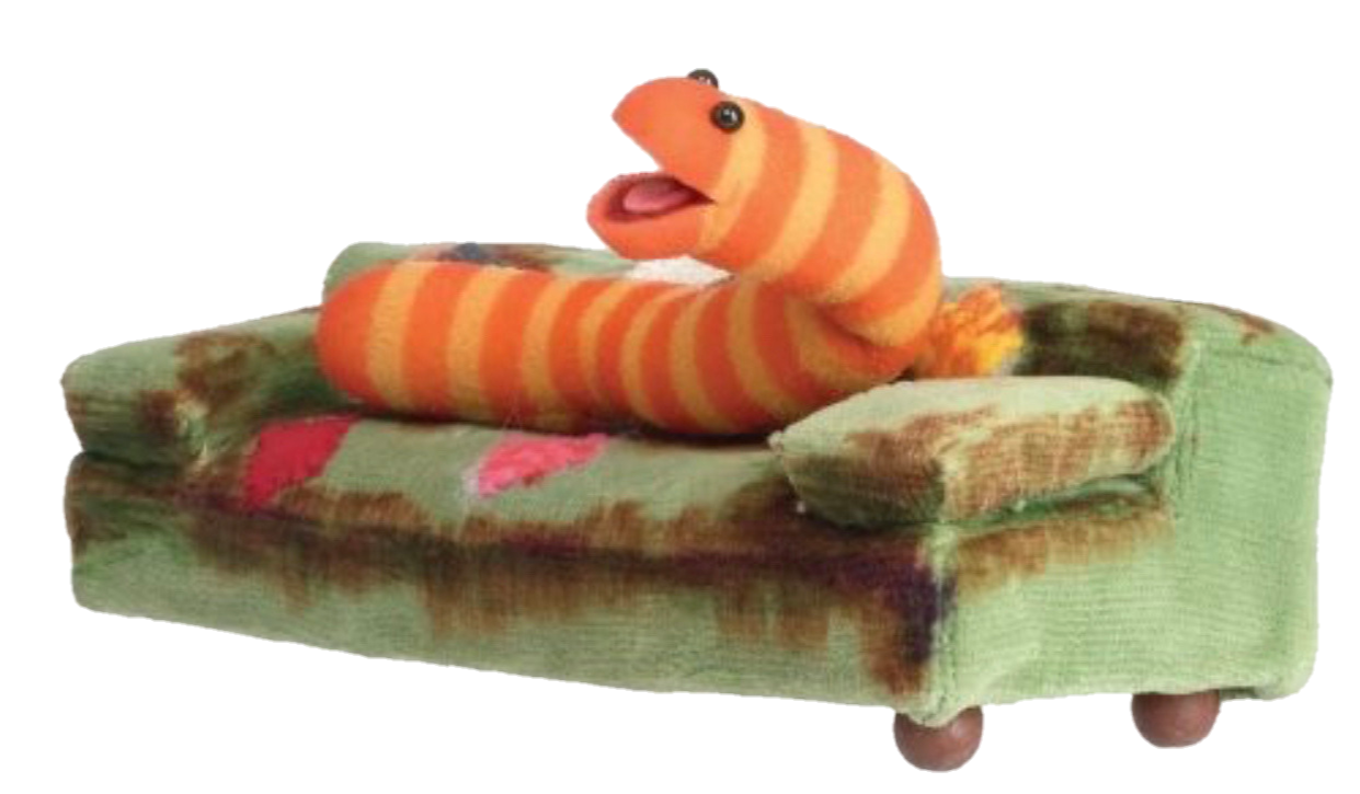 picture of Slimey the Muppet worm on a couch with its mouth open